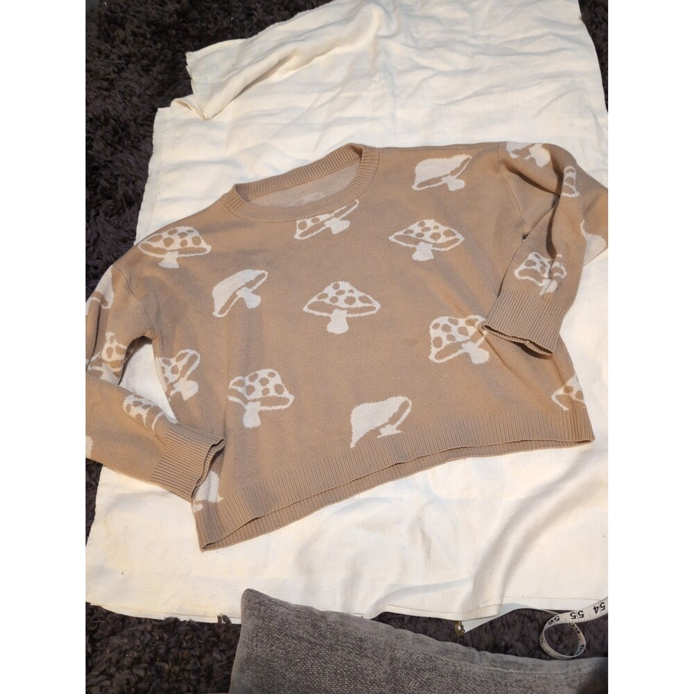 Tan mushroom sweater size medium.